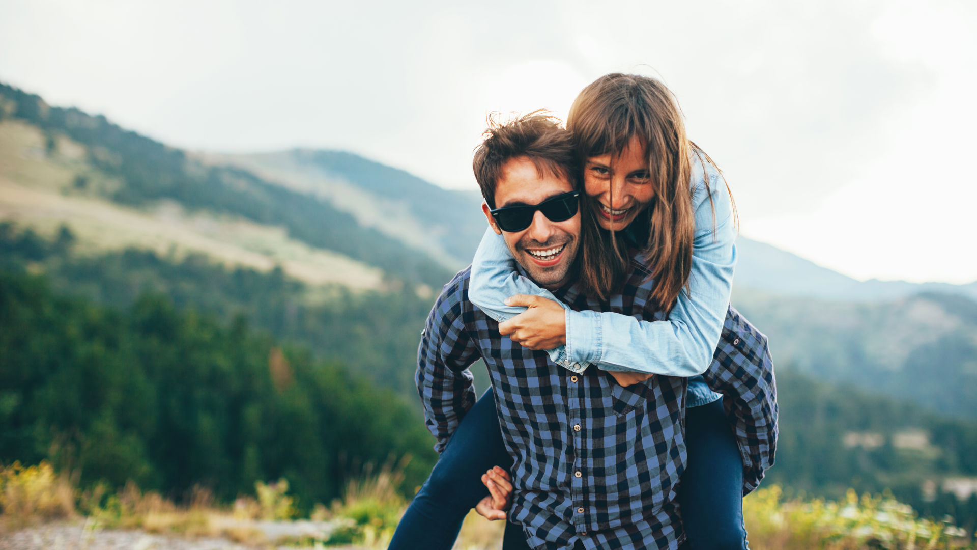 Girl getting a piggy back from her bpyfriend