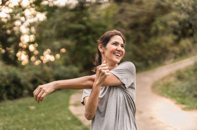 GMHBA member stretching in the park