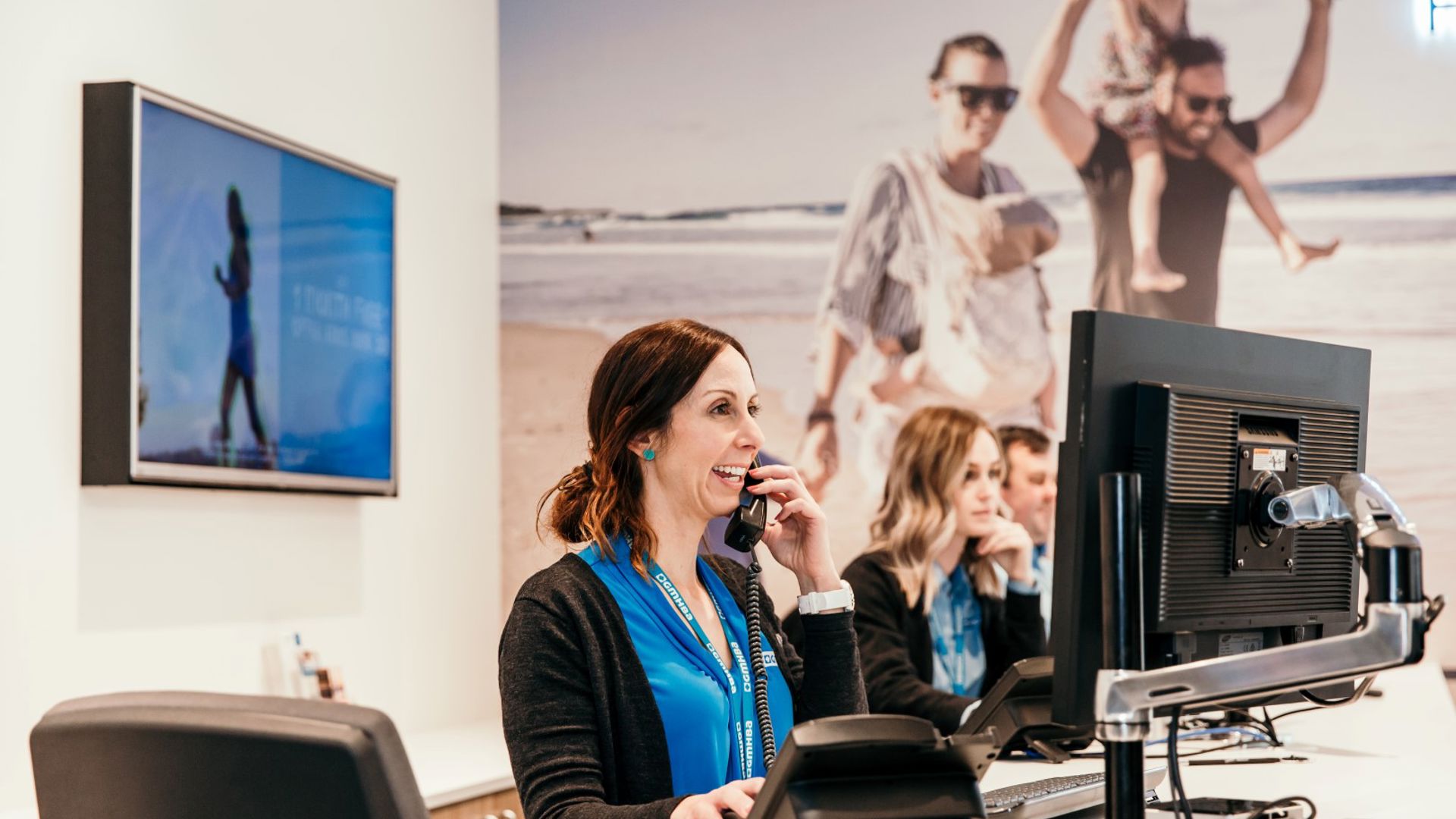 GMHBA employee laughing whilst at work