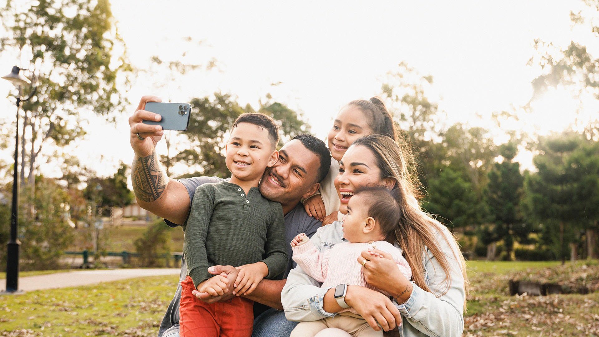 happy family enjoying time together and taking selfie